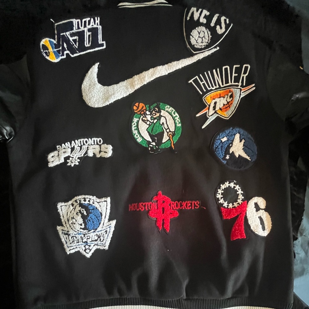 Nike Black Jacket with White Swoosh and Multicolor NBA Patches